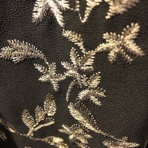Beautiful gray dress with embroidered flowers.